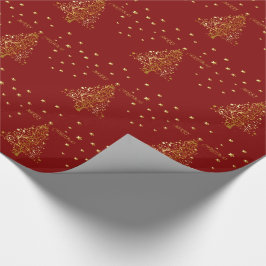 Schöne metallische Weihnachtsbaum auf dunkelrot Geschenkpapier