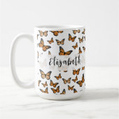 Schöne orangefarbene Schmetterlinge mit eigenem Na Kaffeetasse (Links)