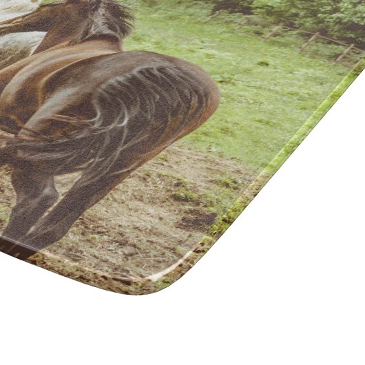 Schöne Pferde laufen Schneidebrett (Ecke)