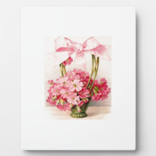 Schöne Vintage-Rosa-Blumen im grünen Korb Fotoplatte