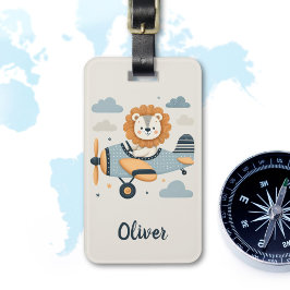 Schöne, weiße Löwe auf einem charmanten Flugzeug Gepäckanhänger