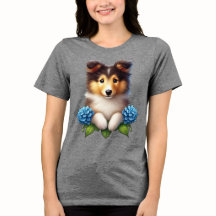 Schöne Welpe mit blauen Blumen