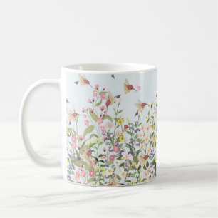 Schöner Kolibri in einer blumengeschmückten Blume Kaffeetasse