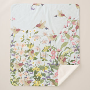 Schöner Kolibri in einer blumengeschmückten Blume Sherpadecke