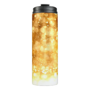 Schöner luxuriöser goldgelber Glitzer Hintergrund. Thermosbecher