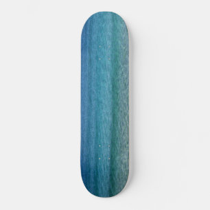 Schöner Sandstrand Skateboard