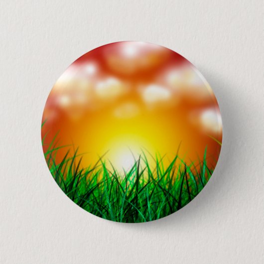 Schöner Sonnenaufgang über einem Grasfeld Button (Vorderseite)