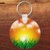 Schöner Sonnenaufgang über einem Grasfeld Schlüsselanhänger (Vorderseite)