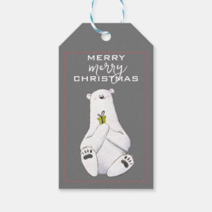 Schöner weißer Polar-Bär mit einem kleinen grünen  Geschenkanhänger