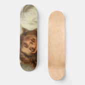 Schönes Mädchen liegt im Bett mit rotem Haar Skateboard (Vorderseite)