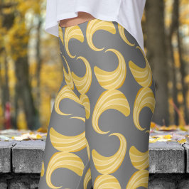 Schönes Muster aus Grau- und Goldkurven Leggings