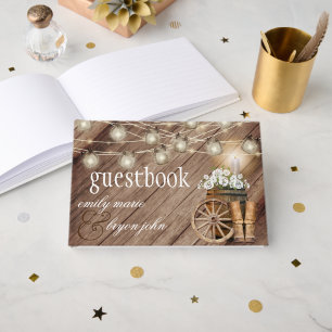 Schönes Rustikales Holzfass mit weißer Blüte Gästebuch