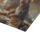 Schottischer Terrier kocht in der Küche Schneidebrett (Ecke)
