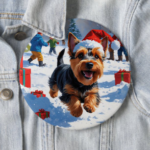 Schottischer Terrier läuft durch Schnee mit Weihna Button