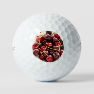 Schüssel mit Kirschen Golfball