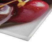 Schüssel mit Kirschen Schneidebrett (Ecke)