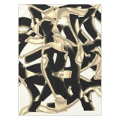 Schwarz-Beige-Schrott, zerstörte Bänder auf klarem Tischdecke (Vorderseite)