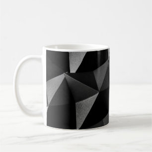 Schwarz gefaltetes strukturiertes Papier abstrakt  Kaffeetasse