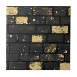 Schwarz-Golden-Brock-Muster Fliese
