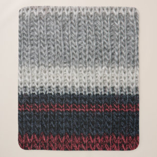 Schwarz-Graue Strickwolle mit rot-weißem Stift Sherpadecke