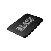 Schwarz mit grauem Text auf schwarzer, solider Far Badematte (Schrägansicht)
