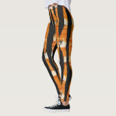 Schwarz-Orange-Streifenmuster Leggings (Links)