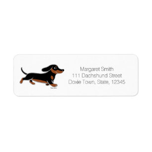 Schwarz und Tan Dachshund läuft