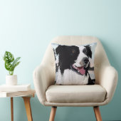 Schwarz-Weiß-Border-Collie bei Sonnenaufgang durch Kissen (Stuhl )