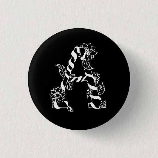Schwarz-Weiß-Buchstabe "A" mit Twining-Blume Button (Vorderseite)