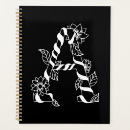 Schwarz-Weiß-Buchstabe "A" mit Twining-Blume Planer