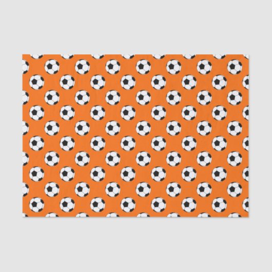 Schwarz-Weiß-Fußball-Bälle auf Orange Seidenpapier (Vorderseite)
