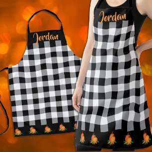 Schwarz-Weiß-Gingham-Muster und Kürbis Schürze