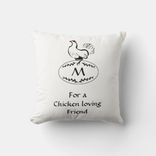 Schwarz-Weiß-Hen auf einem Monogramm-Ei Kissen