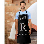 Schwarz-Weiß-Monogramm und Personalisierte Bezeich Schürze<br><div class="desc">Diese einzigartige Designer-Schürze für Ihren Koch verfügt über ein dreistorisches Monogramm - sehen Sie genau hin und Sie werden es selbst sehen. Dies ist Set vor einem schwarzen Hintergrund. Alle Designfragen,  schicken Sie einfach eine E-Mail an charmdesignstudio@rcn.com und wir freuen uns,  Ihnen behilflich zu sein.</div>