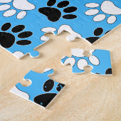 Schwarz-Weiß-Pfoten auf blauem Hintergrund Puzzle (Seite)