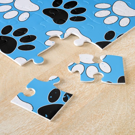 Schwarz-Weiß-Pfoten auf blauem Hintergrund Puzzle (Seite)