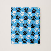 Schwarz-Weiß-Pfoten auf blauem Hintergrund Puzzle (Vertikal)