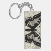 Schwarz-Weiß-Schmetterling im Hintergrund Schlüsselanhänger (Vorderseite links)