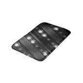 Schwarz-Weiß-Twinkl-Leuchten Badematte (Schrägansicht)