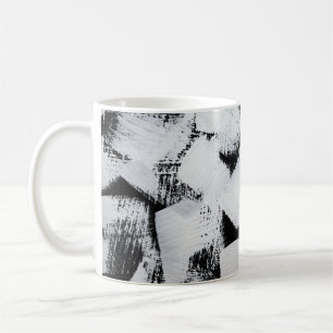 Schwarz-weiße, abstrakt gestrichene Leinwand. Kaffeetasse