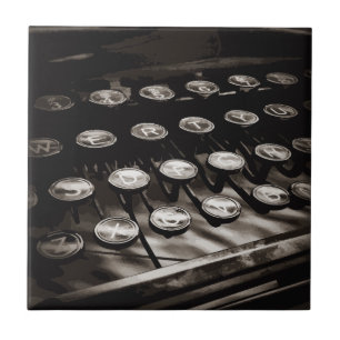 Schwarz-weiße alte Schreibschrifttasten Fliese