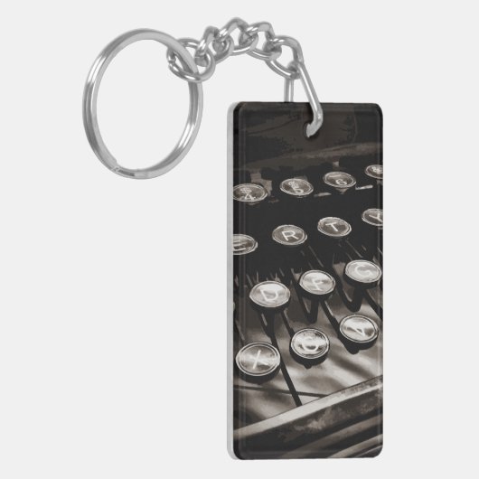 Schwarz-weiße alte Schreibschrifttasten Schlüsselanhänger (Vorderseite links)