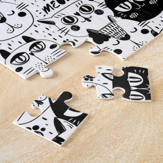 Schwarz-weiße Katzen zeigen Muster Puzzle (Seite)