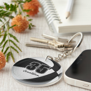 Schwarz-weiße Mannschaftsfarben Basketball-Mädchen Schlüsselanhänger