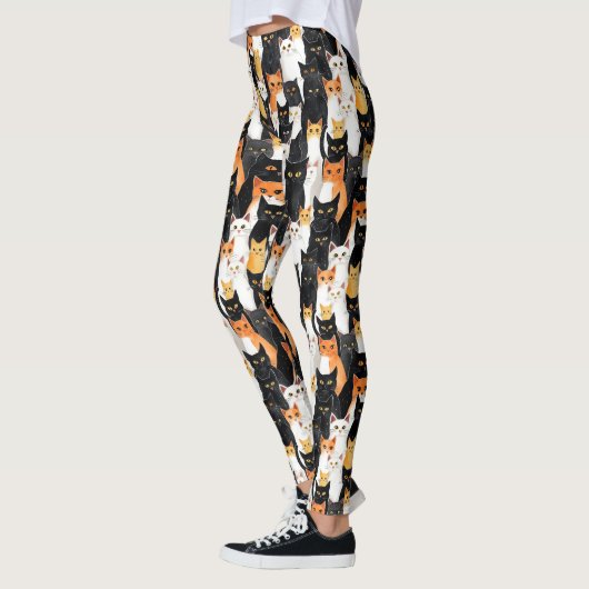 Schwarz-weiße Orangenkatzen Leggings (Links)