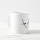 Schwarz-weißer Name der grauen Monogramm Kaffeetasse (Vorderseite Links)