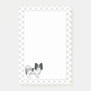 Schwarz-weißer Papillon-Cartoon-Hund mit Pfoten Post-it Klebezettel