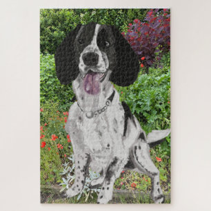Schwarz-weißer Springer Spaniel vor einer Blume Puzzle