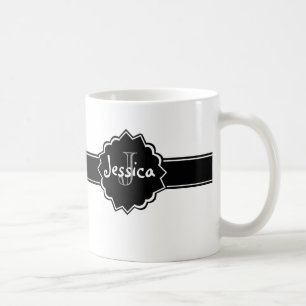 Schwarz-weißes Abzeichen mit Monogramm Kaffeetasse