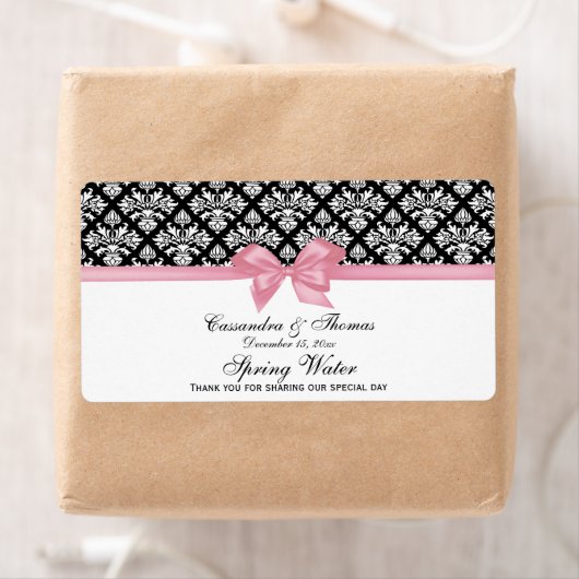 Schwarz, weißes Damaswasser-Etikett Rosa Bogen (Insitu)
